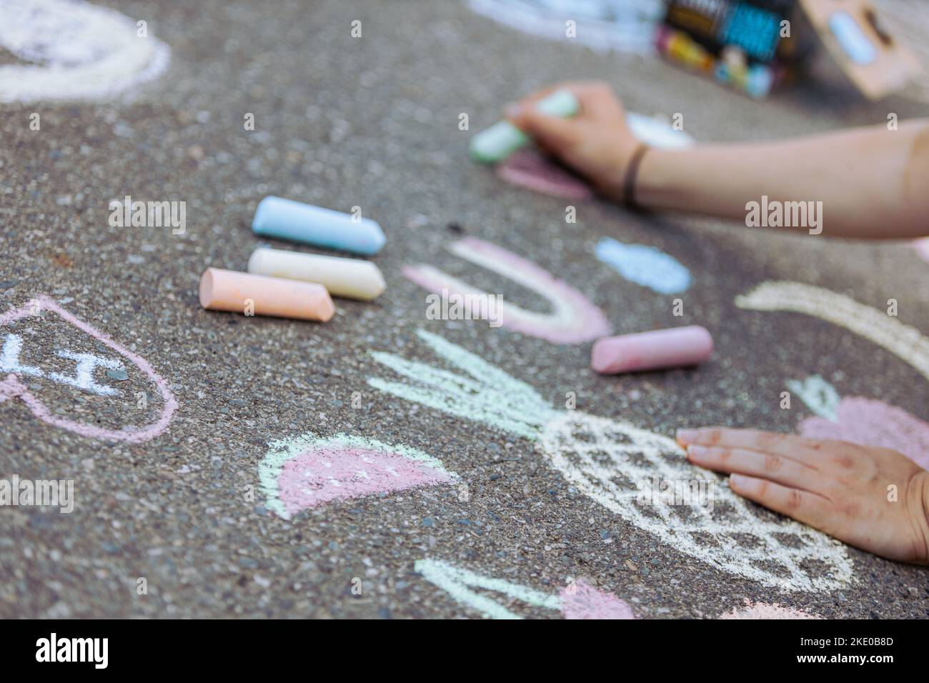 People chalk drawing on the pavement ground Stock Photo Alamy