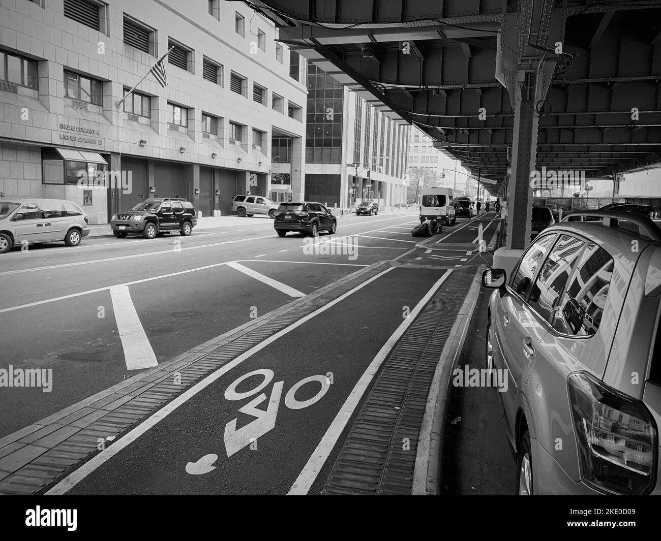 New York, NY, USA - Nov 9, 2022: The bike lane alongside South St facing north under the FDR Drive Stock Photo