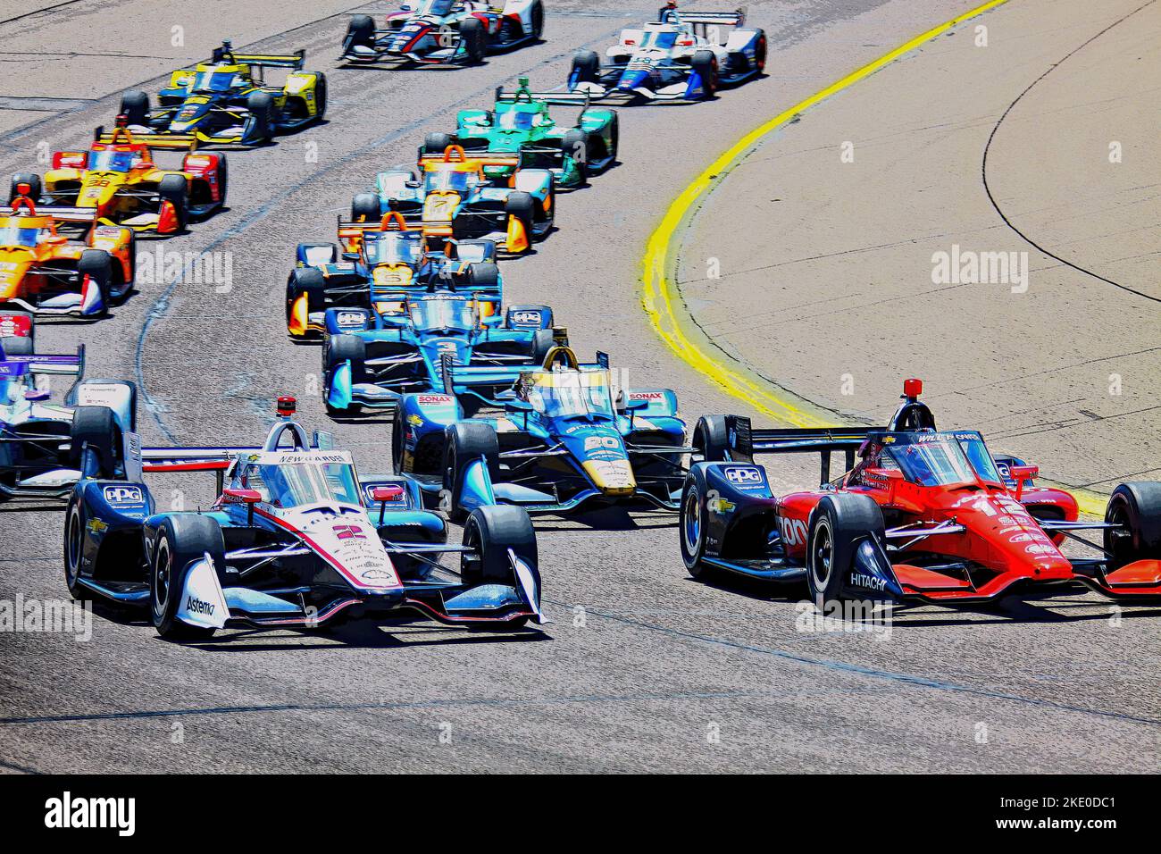 Newton, IA USA - 24 July 2022: Race Start, Will Power #12, leads the pack into the first corner at Iowa Speedway. Josef Newgarden #2 on left. FILTERED Stock Photo