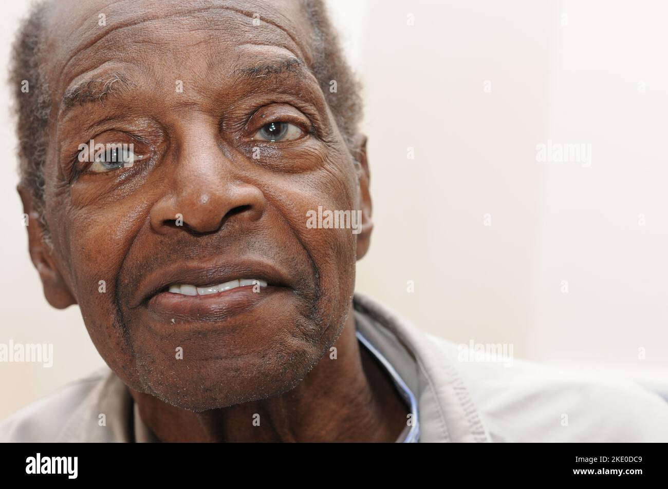Front view portrait of an elderly black man with grey eyes Stock Photo ...