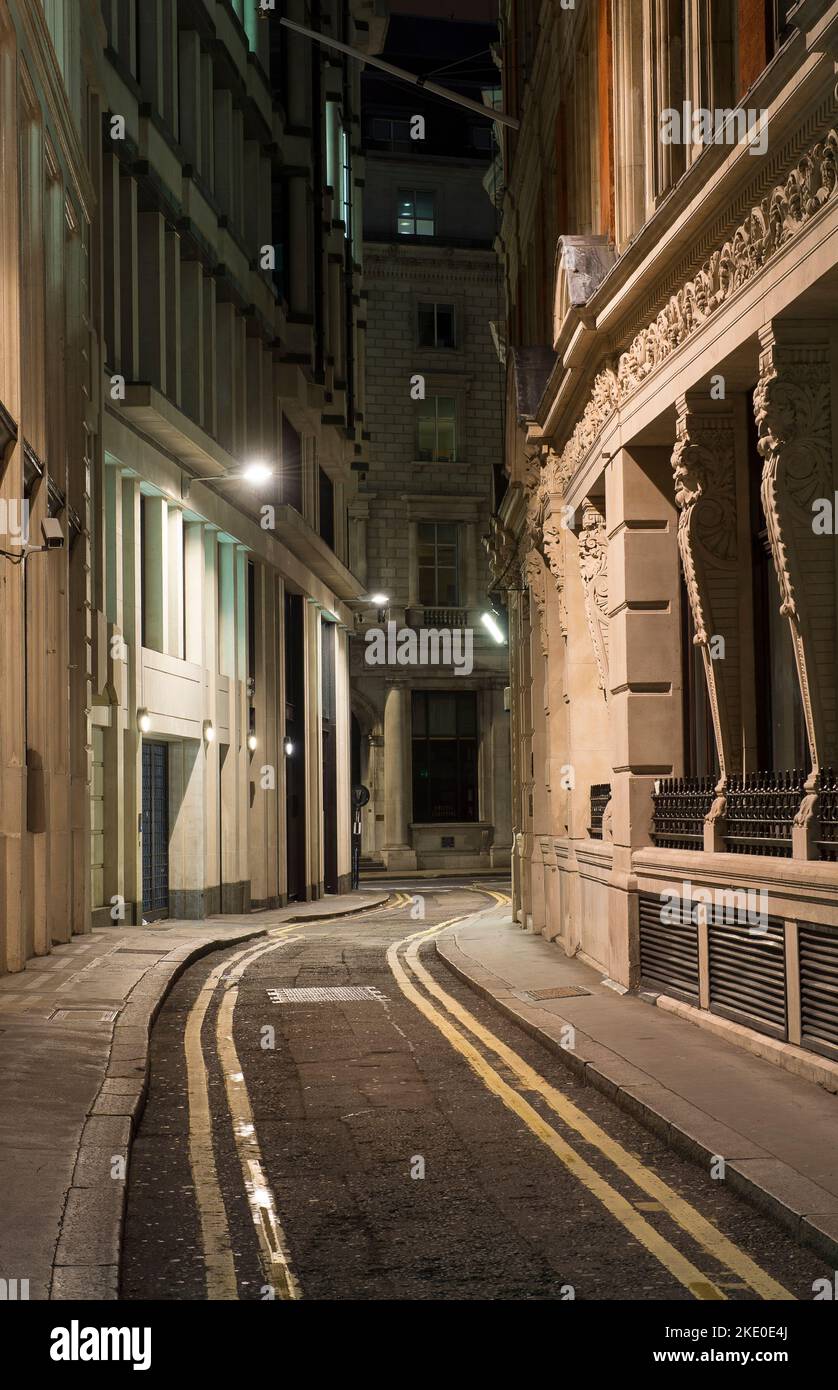 Empty street in the City of London at night, England. Stock Photo