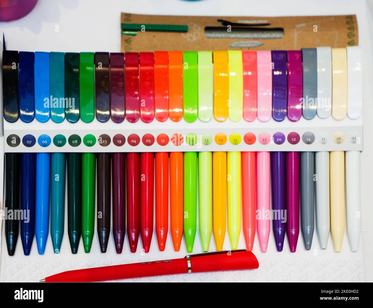a group multi-colored plastic ballpoint pens on white table Stock Photo ...