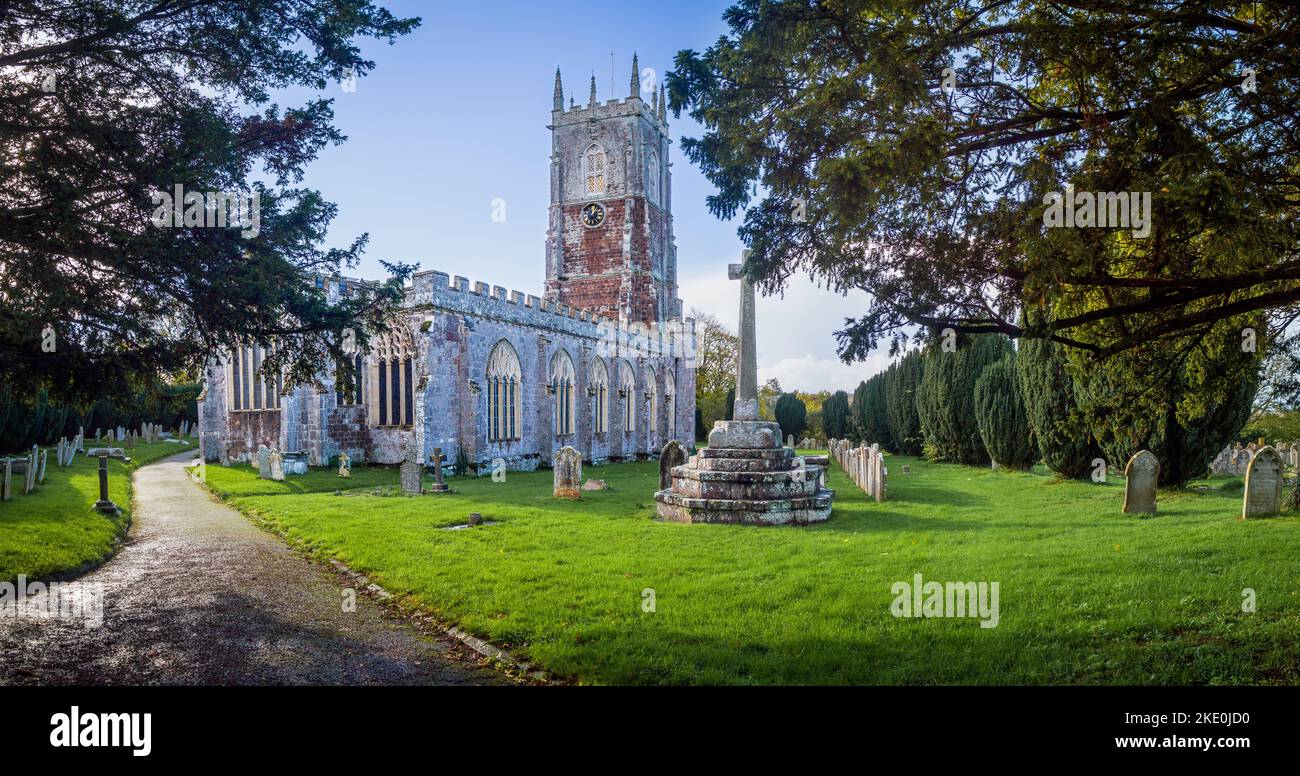 St John the Baptist church is a picturesque 13th century church in the heart of this semi rural village. Stock Photo