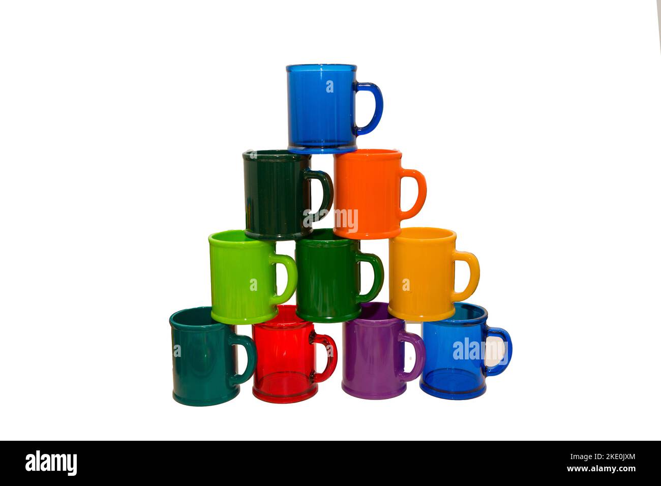Colorful plastic mugs made of ecofriendly materials on a white