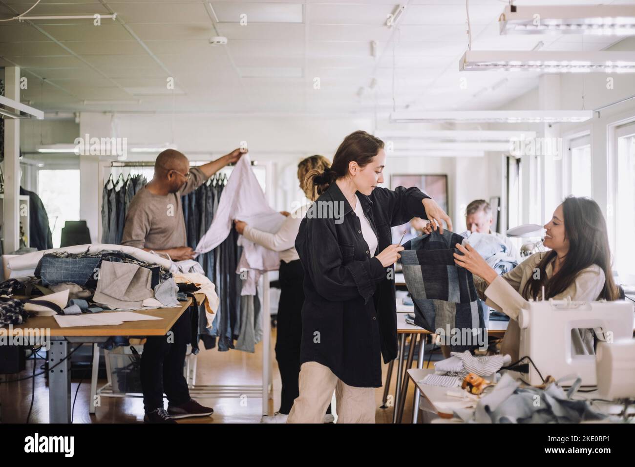 Fashion designers working together at workshop Stock Photo