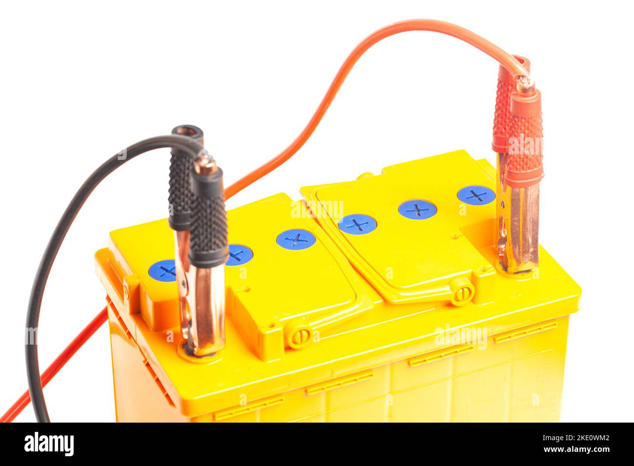 Charging the car acid battery. The charger terminals are connected to