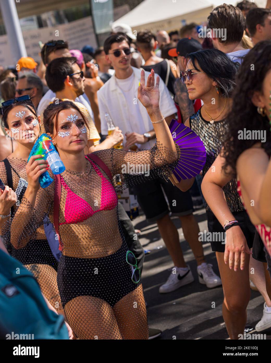 A vertical shot of people during the Love Parade in Zurich, Switzerland Stock Photo