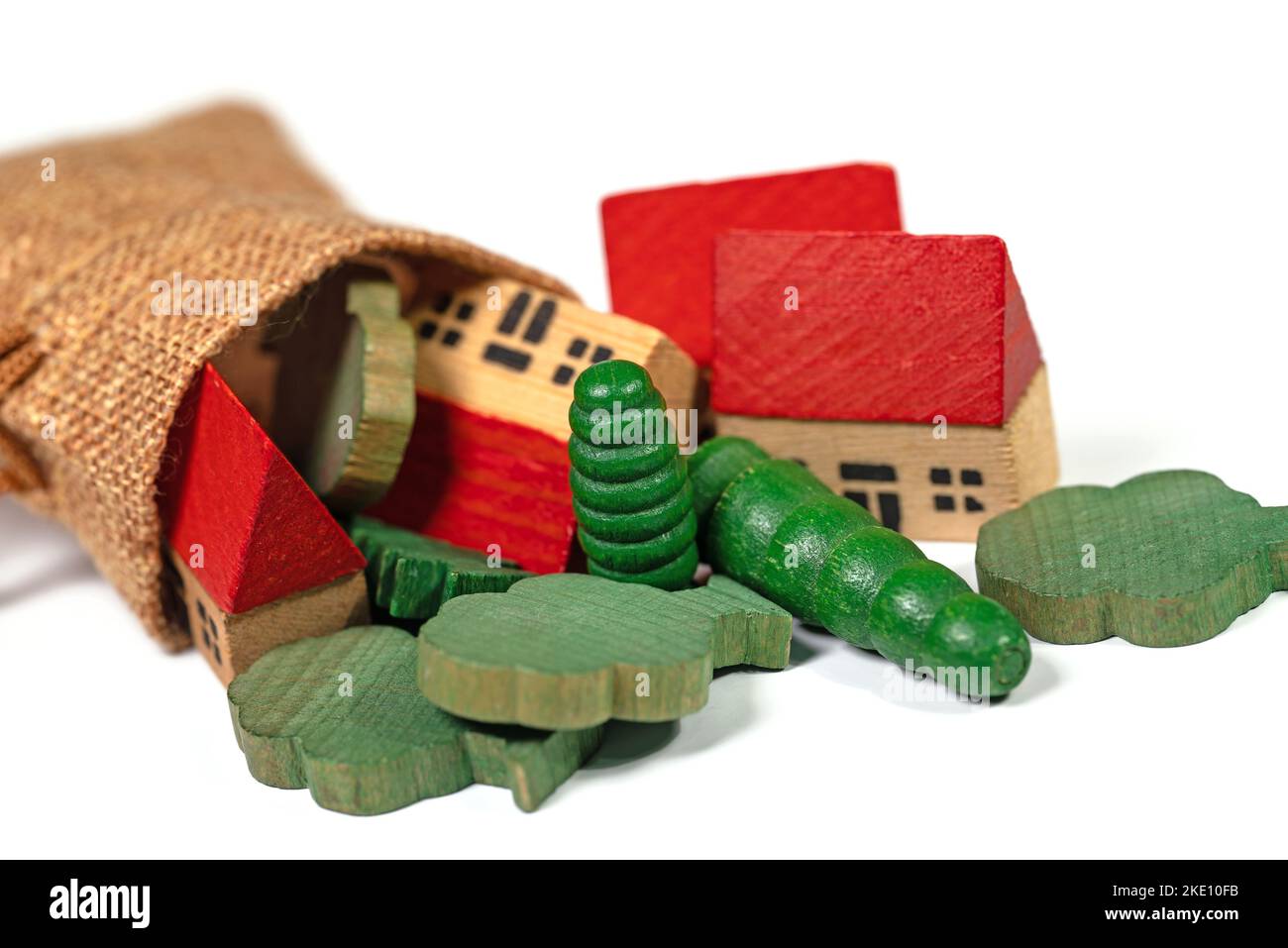 Houses and trees as wooden toys against a white background Stock Photo