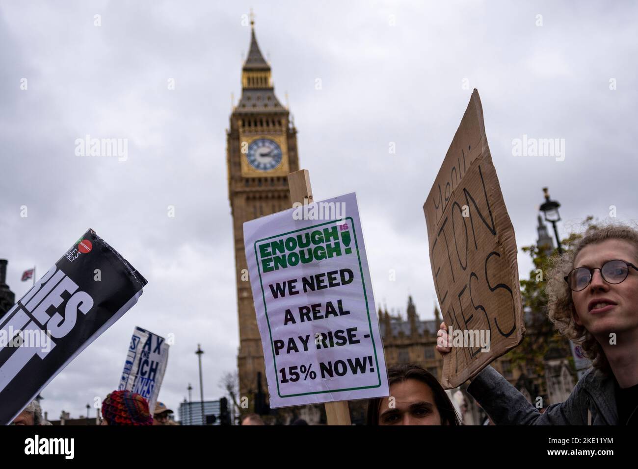 Enough is enough placard at a protest in London against Conservative government austerity measures, calling for a general election and higher wages. Stock Photo
