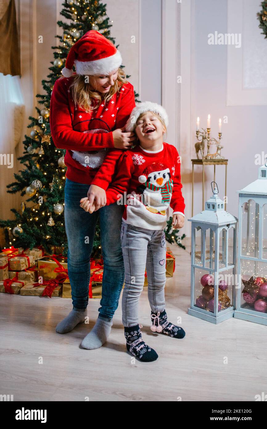 Laughing mother and daughter sweaters hi res stock photography and images Alamy