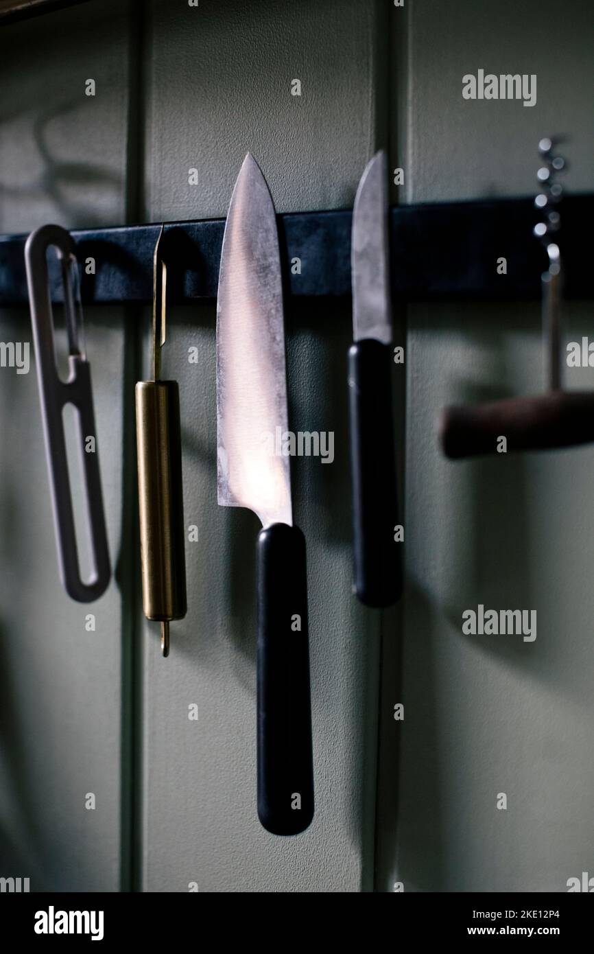 Kitchen knife and tools hanging on Stock Photo Alamy