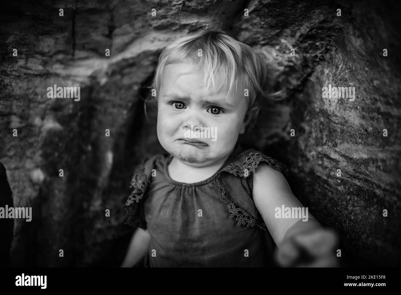 Emotional portrait of upset little girl crying Stock Photo