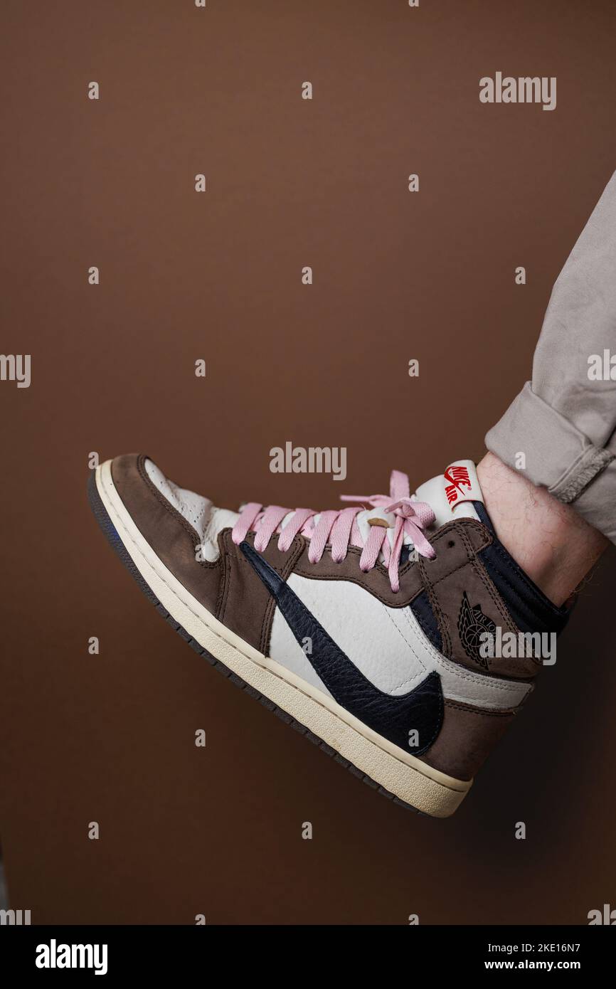 A vertical closeup of Nike Air Jordan 1 High 'Travis Scott' with pink shoe  laces Stock Photo - Alamy