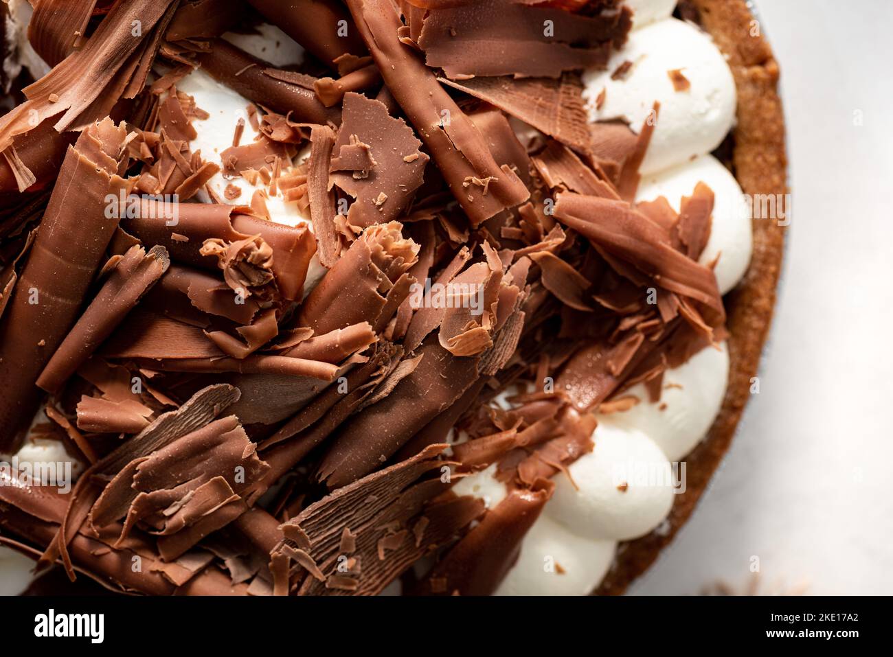 Close up overhead shot of chocolate pie with chocolate shavings Stock Photo