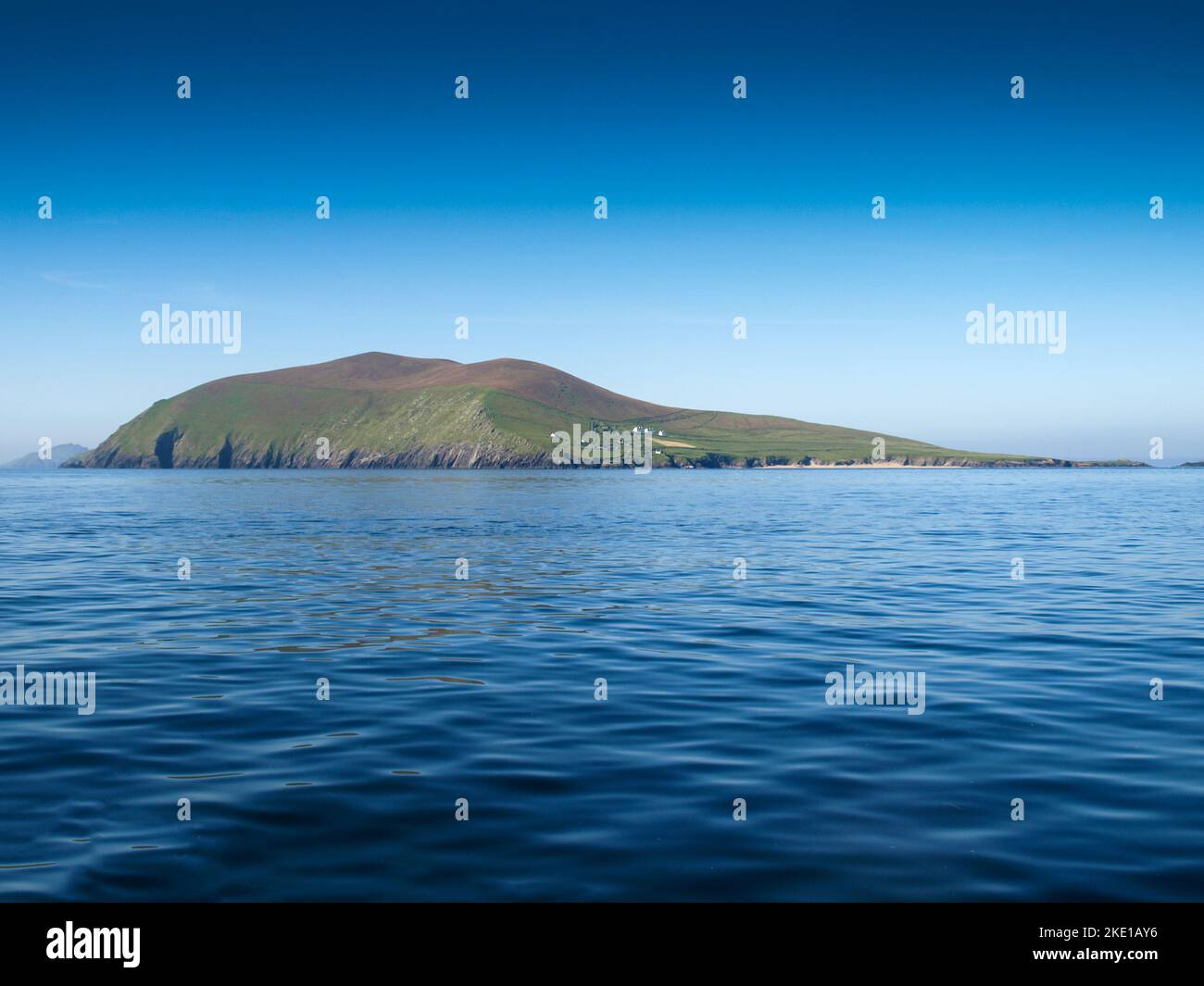 Blasket island, view from a fishing boat near the Slea Head on the Dingle Peninsula in Ireland with a clear deep blue sky Stock Photo