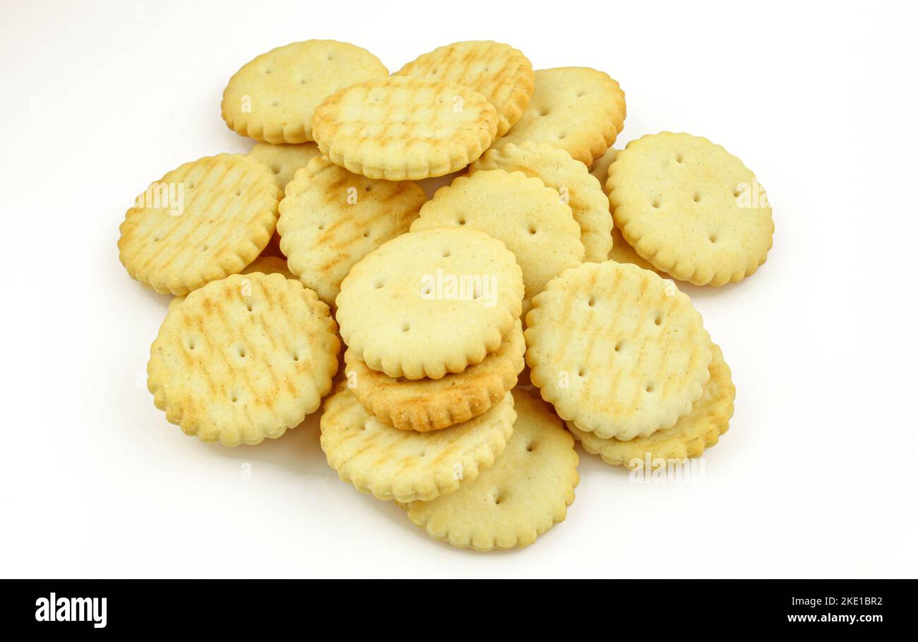 Pile of salty round crackers isolated on white background Stock Photo
