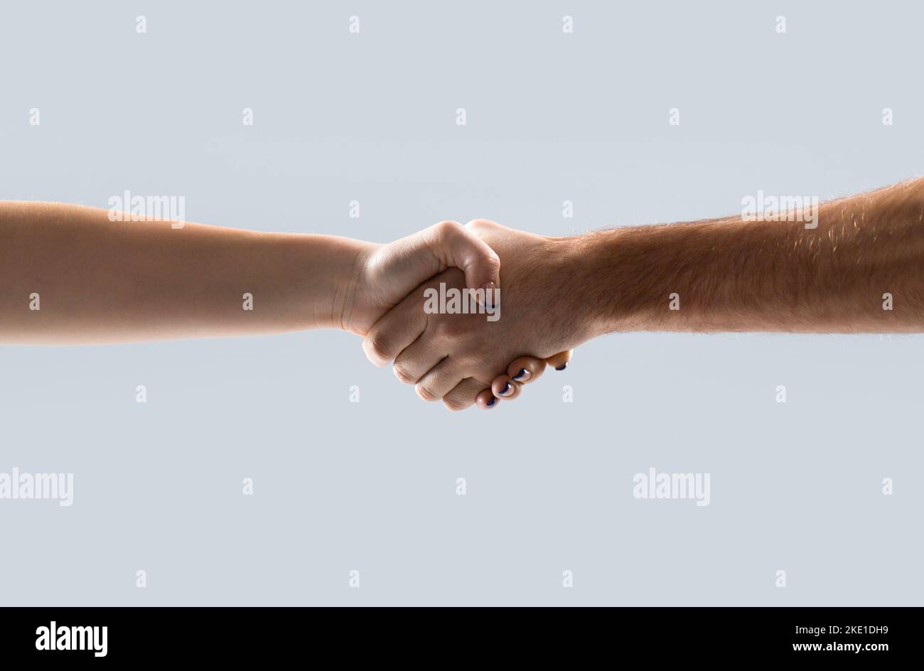 Friendly handshake, friends greeting, teamwork, friendship woman. Two hands, helping arm of a