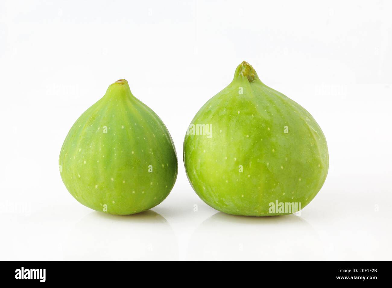 Two green figs isolated on white background Stock Photo Alamy