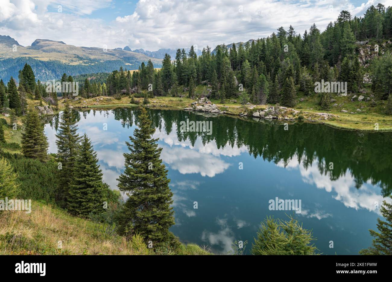 the Colbricon lakes in summer with the mountain reflected on the water ...