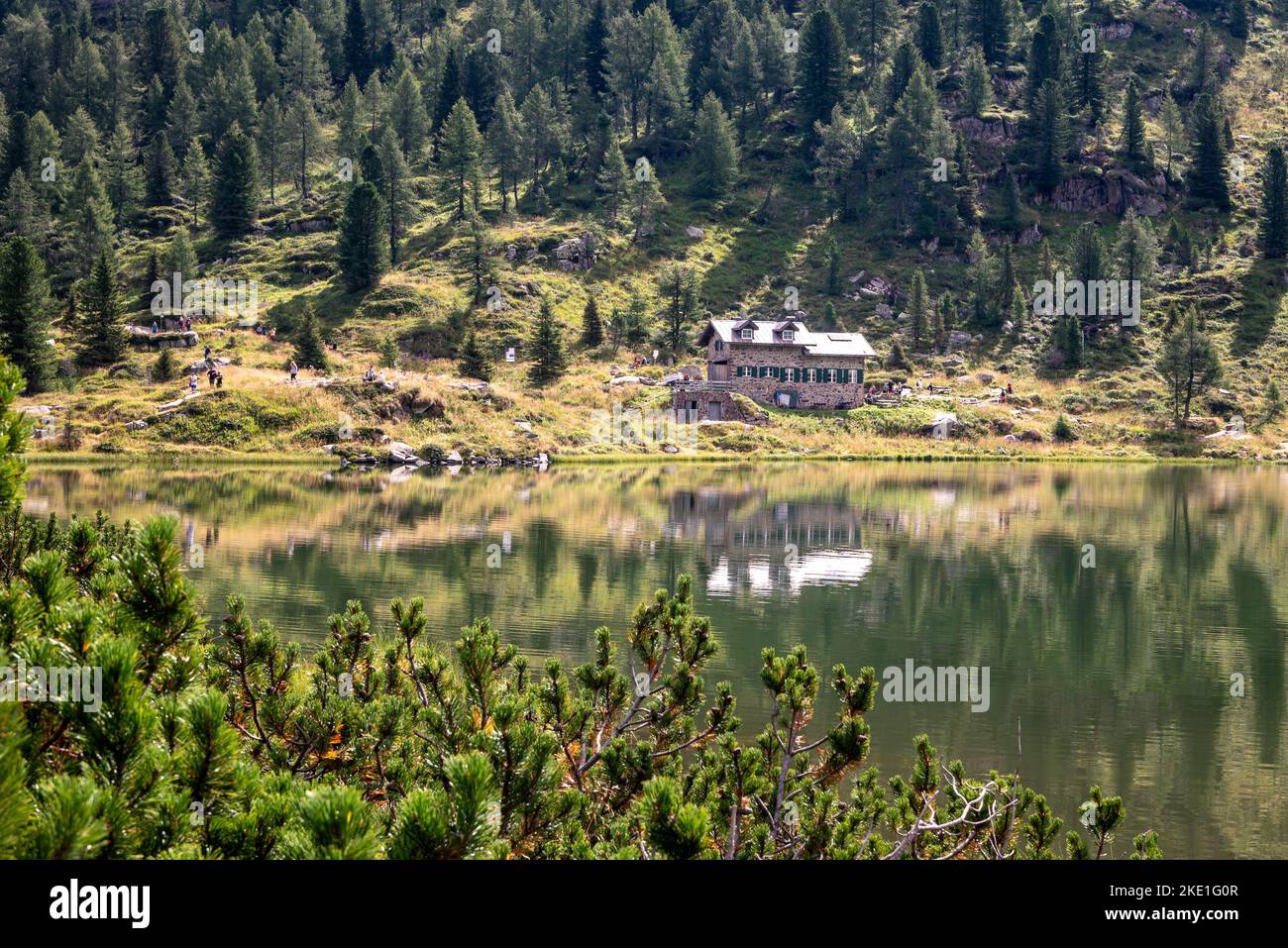 the Colbricon lakes in summer with the little alpine hut near the lakes ...
