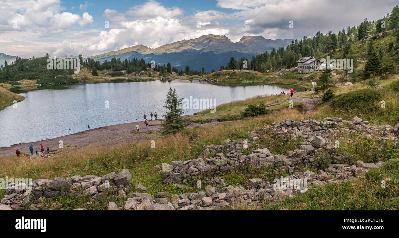 the Colbricon lakes in summer with the little alpine hut near the lakes ...