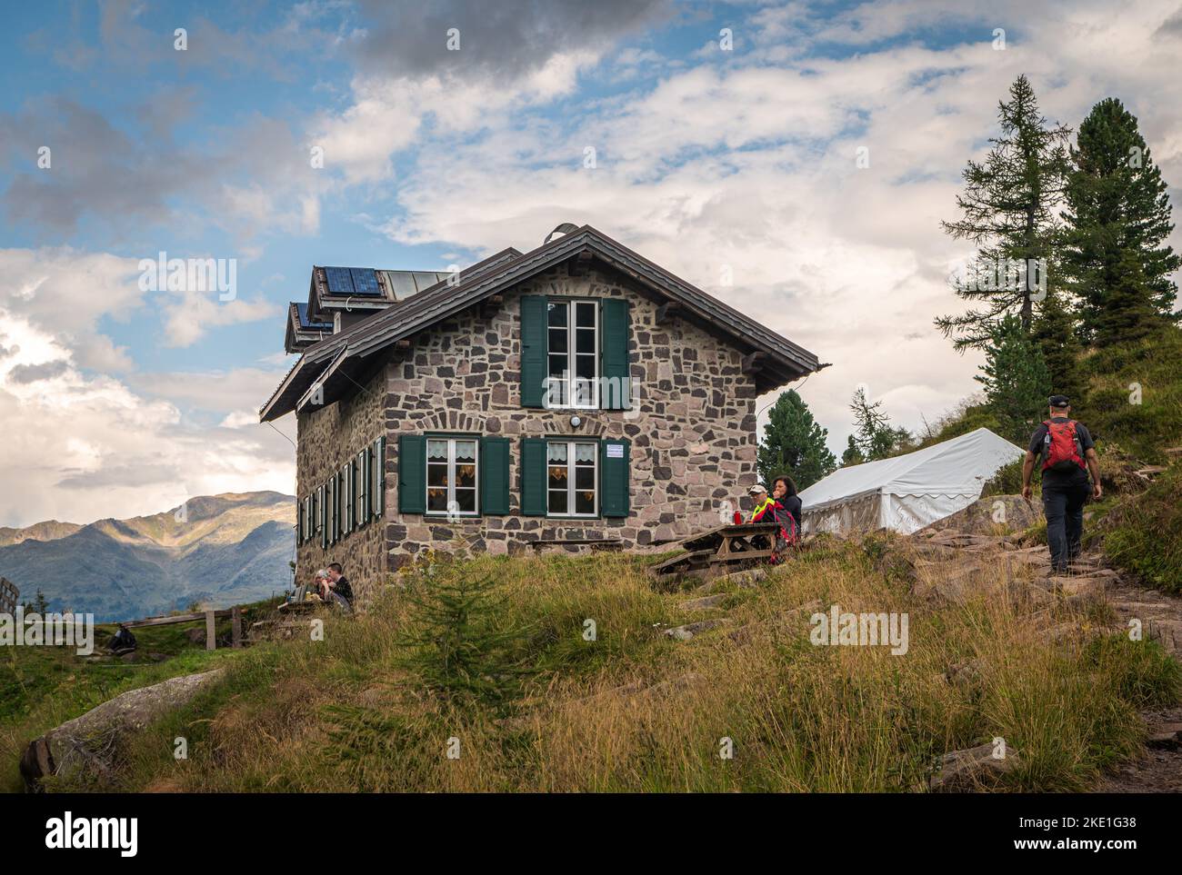 the Colbricon lakes in summer with the little alpine hut near the lakes ...