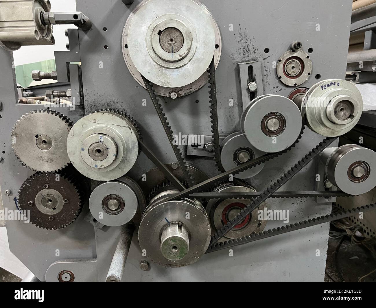 A closeup of a mechanism of automatic full-stripping roll die-cutting and creasing machine Stock Photo