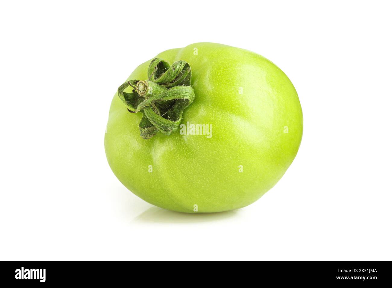 Whole organic green tomato isolated on white background Stock Photo - Alamy