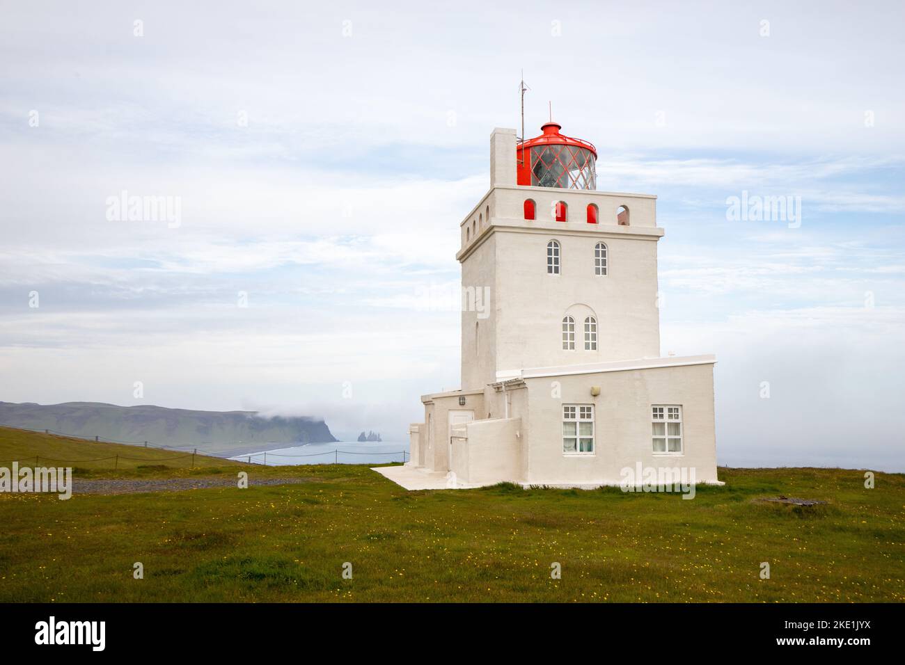 The lighthouse of the Dyrholaey promontory on the coast of Iceland Stock Photo