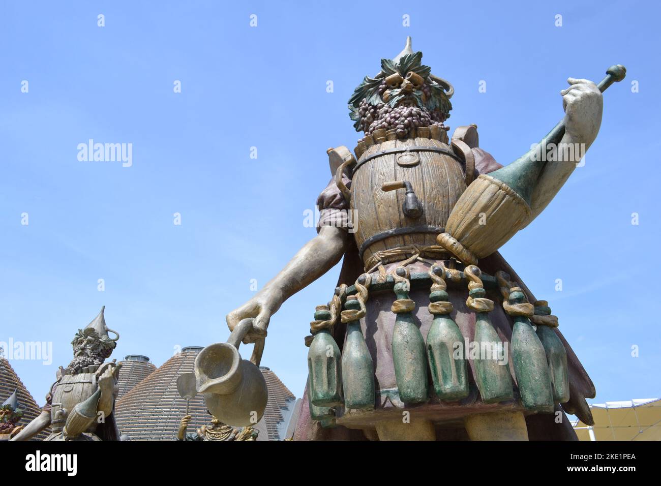 Statue of Enolo winemaker standing in a group of statues of The Food People by Dante Ferretti at the Expo Milano 2015. Stock Photo