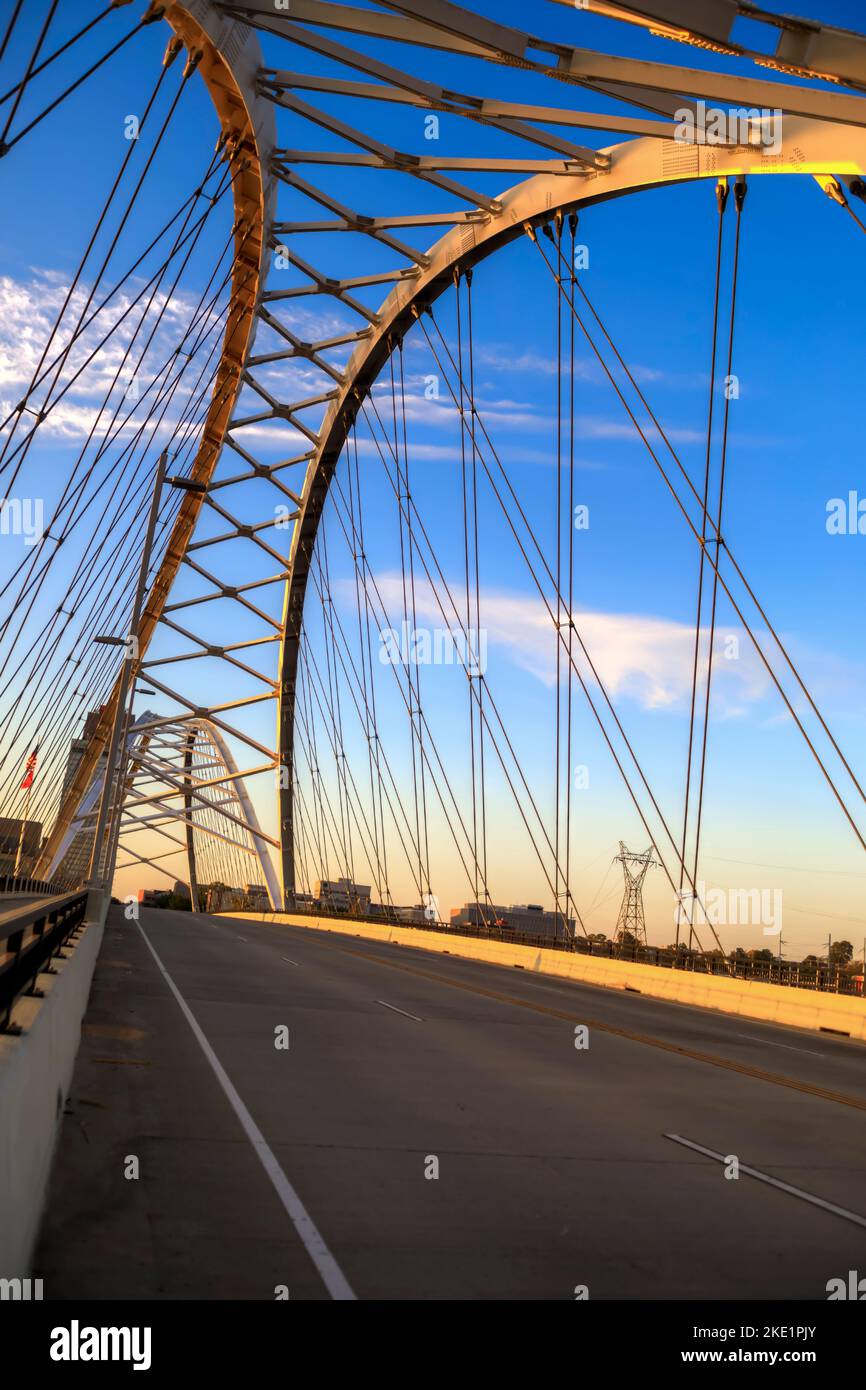 The Broadway Street Bridge spanning over the  Arkansas River, in downtown Little Rock, Arkansas  at sunrise. Stock Photo