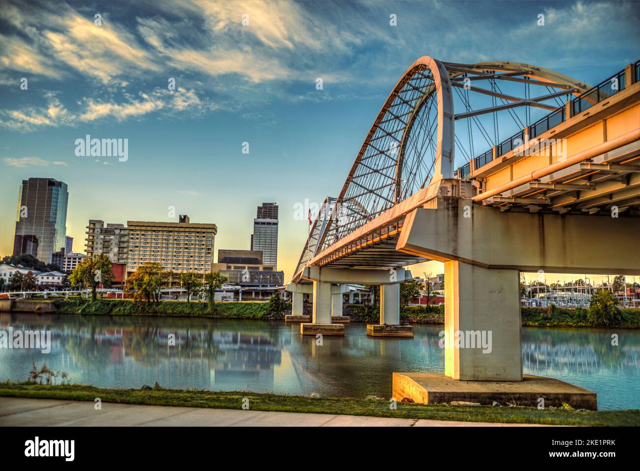 The Broadway Street Bridge spanning over the  Arkansas River, in downtown Little Rock, Arkansas  at sunrise. Stock Photo