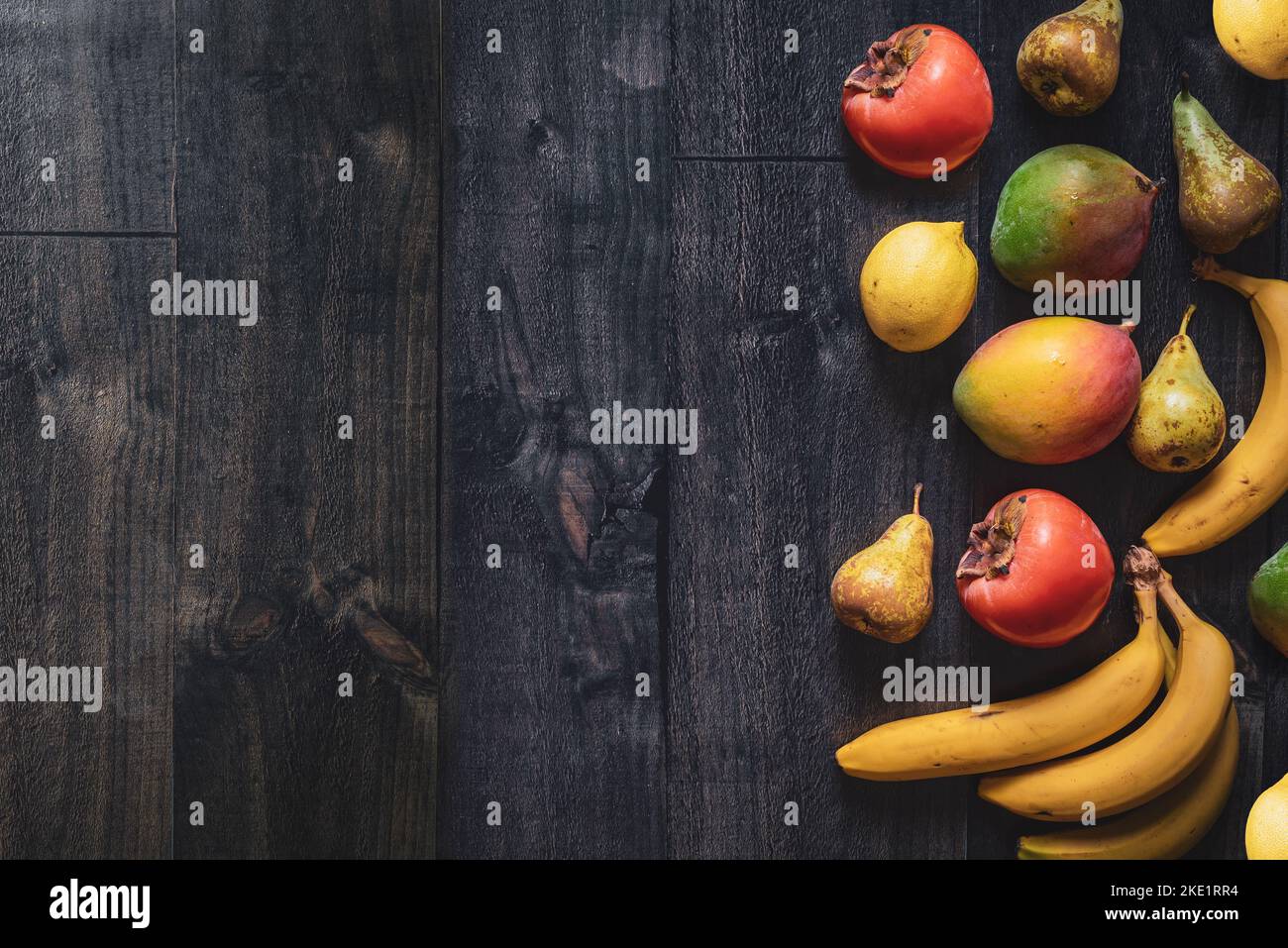 Dark wood background with fruits. Banner for fruit shops and