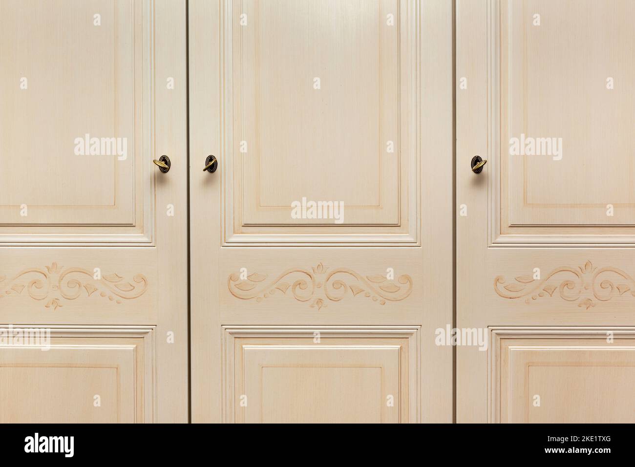 Front wooden frame of the door cabinet made of light wood, background and texture.  Wooden wardrobe door for interior design creative background, with Stock Photo