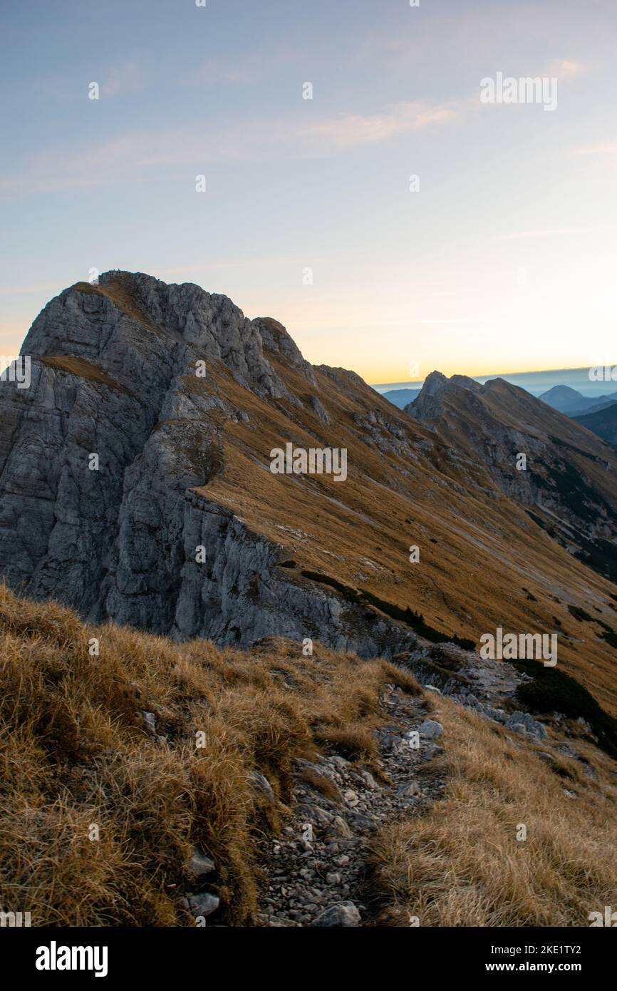 Sunrise in mountains in autumn with golden grass leaves you speechless. Stock Photo
