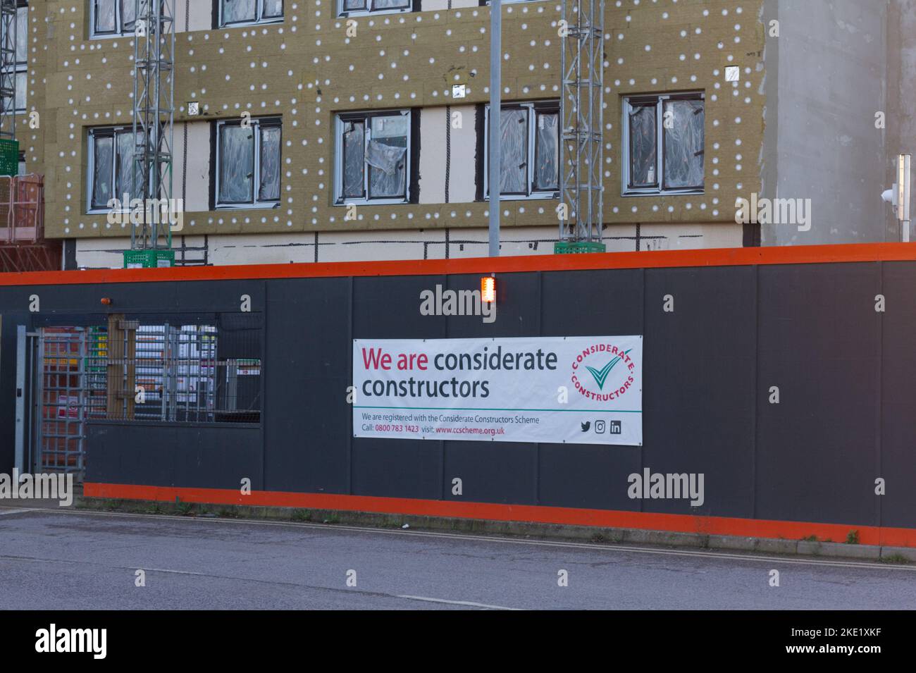 Considerate Constructors sign outside of a construction site. This scheme was set up to raise standards in the building industry. Stock Photo