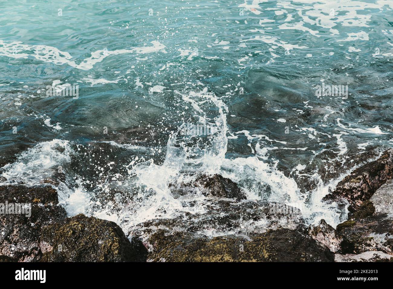 A view of sea waves breaking rocky beach Stock Photo - Alamy