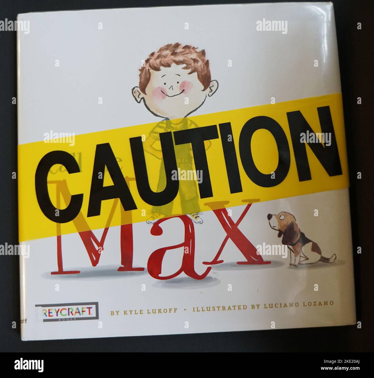 A copy of the children's book Call Me Max with caution tape. The book has been banned in some schools and libraries due to gender identity content. Stock Photo