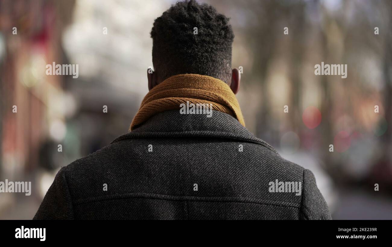 Back black man walking outside hi-res stock photography and images - Alamy
