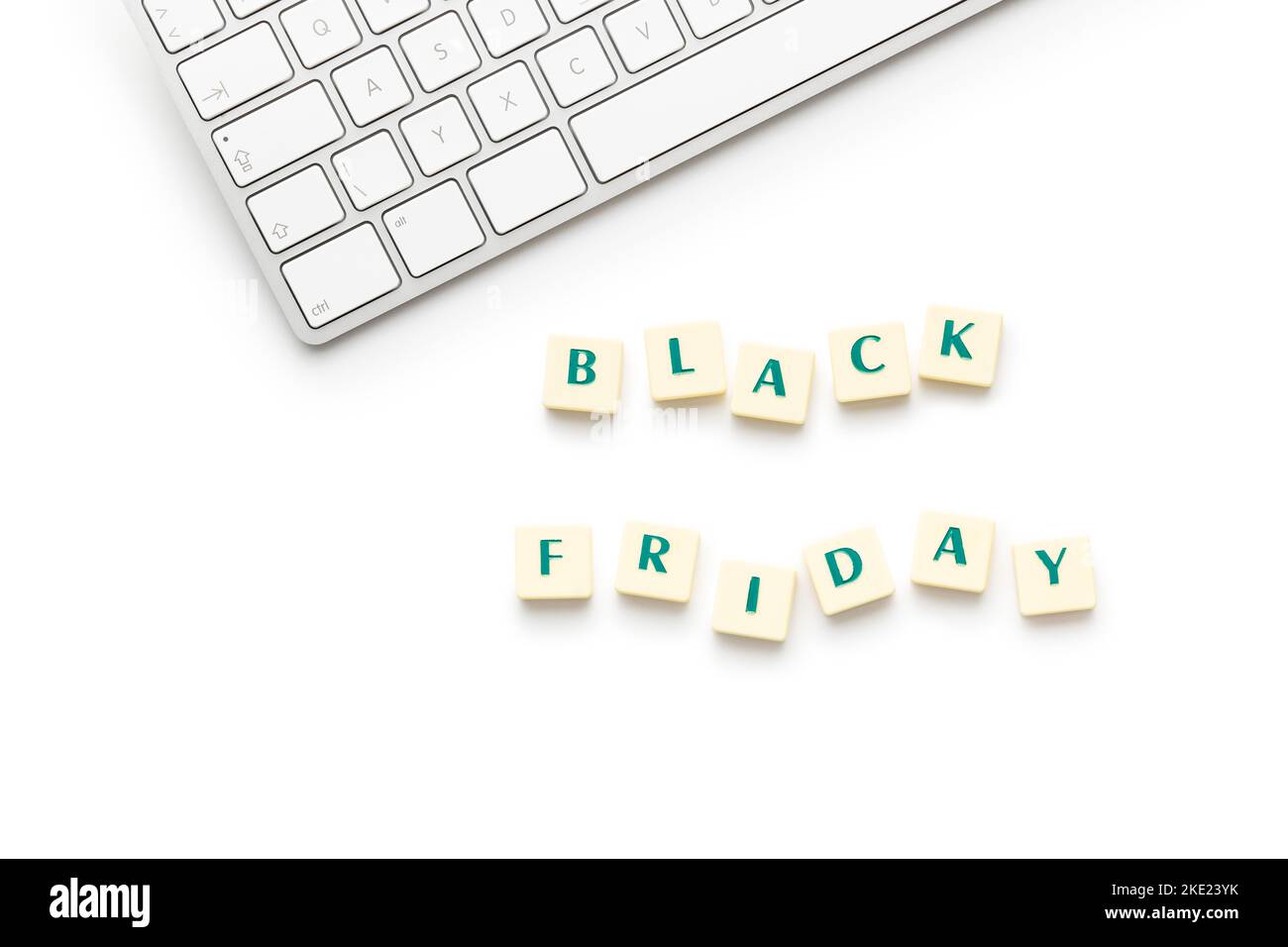 Black friday text and computer keyboard isolated on the white background. Stock Photo