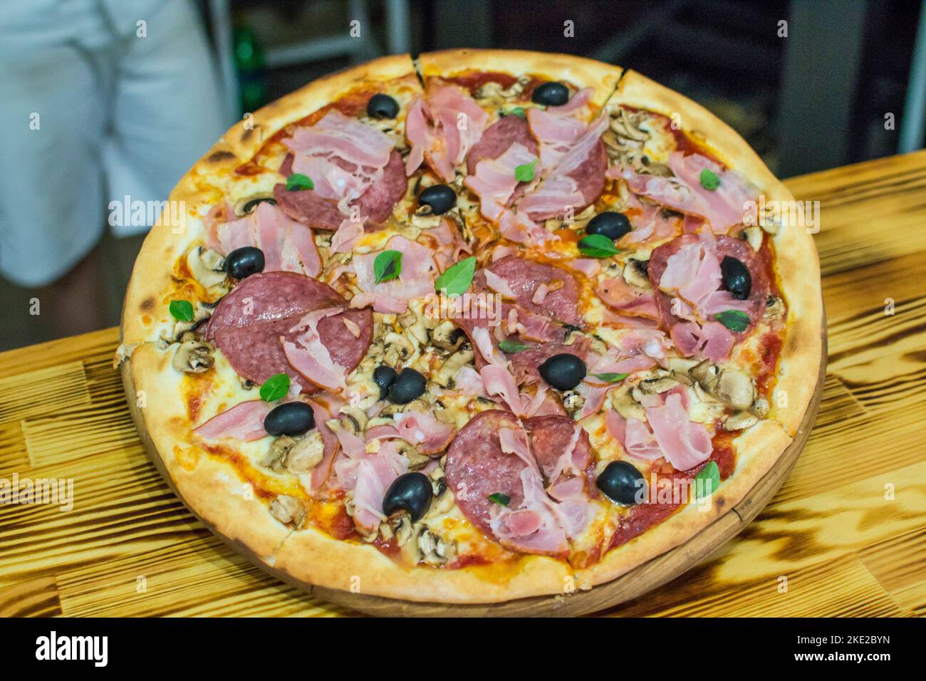cooking pizza in the oven . Pizza near the stone stove with fire. Background of a traditional