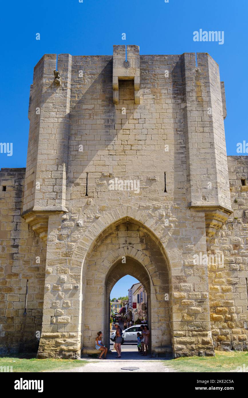 AIGUES-MORTES, FRANCE - AUGUST 4, 2022: View on the old medieval wall with gate built in the 13th century Stock Photo