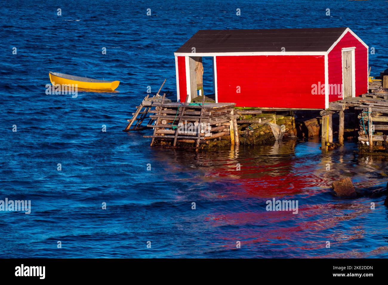 Red 'stage' building and yellow dory, Joe Batt's Arm, Newfoundland and Labrador NL, Canada Stock