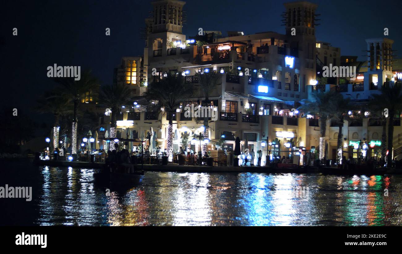 DUBAI, UNITED ARAB EMIRATES, UAE - NOVEMBER 20, 2017:Hotel Jumeirah Al Qasr Madinat ,night walk along the water canal, on a boat. The lanterns illuminate the buildings. High quality photo Stock Photo
