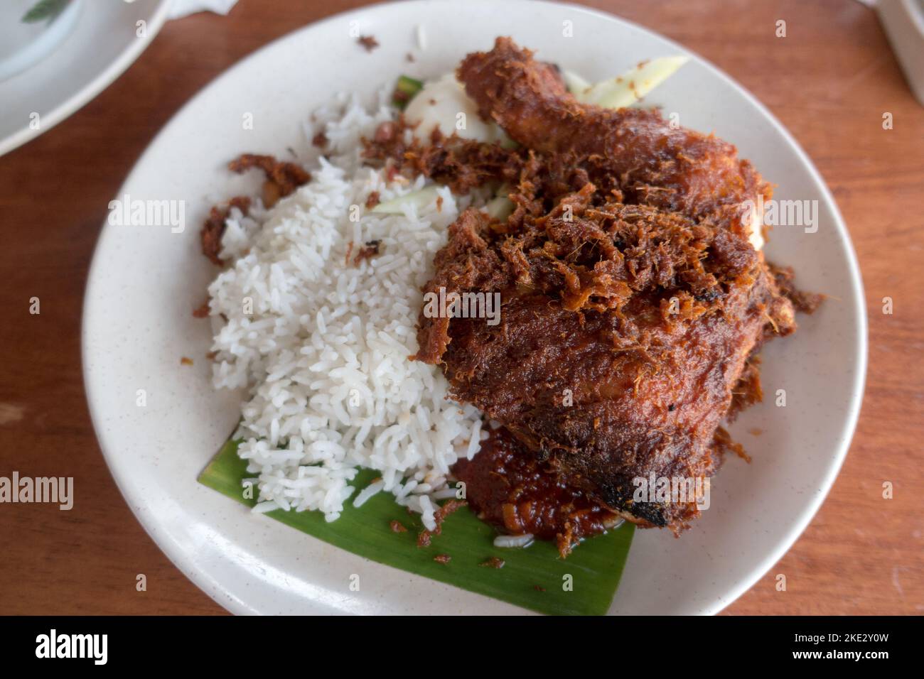 Staple food of many South East Asians, Nasi Lemak is named for the fragrant rice served in this dish which is made with coconut milk. Stock Photo
