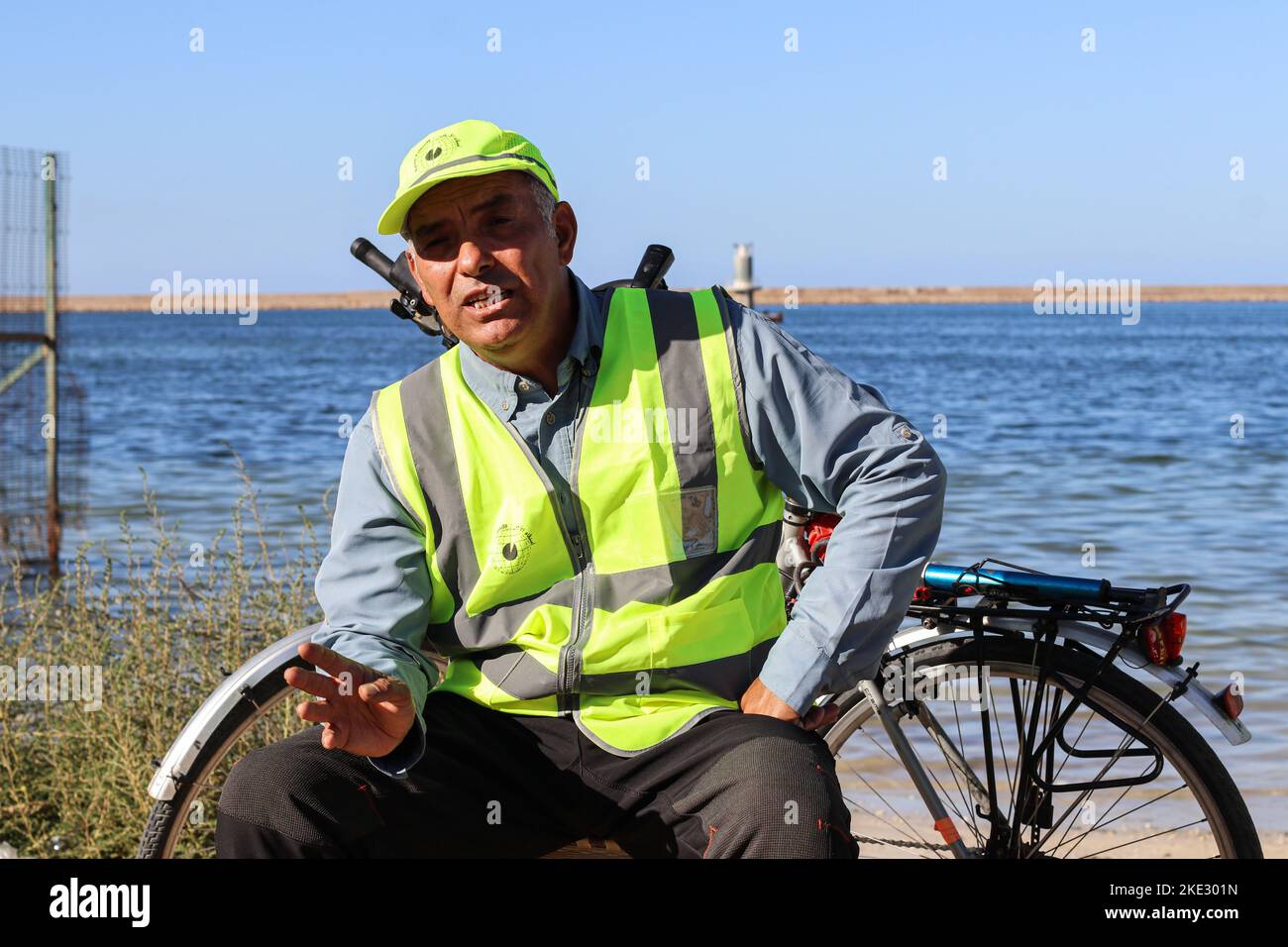 An environmental activist seen during a press interview about his voluntary campaign to clean beaches. Libyan Ali Ragaibi, 52, launched an initiative aimed at cleaning up the waste and garbage scattered on the beaches of Libya to maintain the cleanliness of the country's beaches and in the hope of putting an end to pollution. For 13 years, he has been cleaning up the beach, which he calls the Sea and Sun Campaign, at the end of each summer. The campaign has attracted a large number of followers over the years, and many people are coming to the beach from across the country to do their part, an Stock Photo
