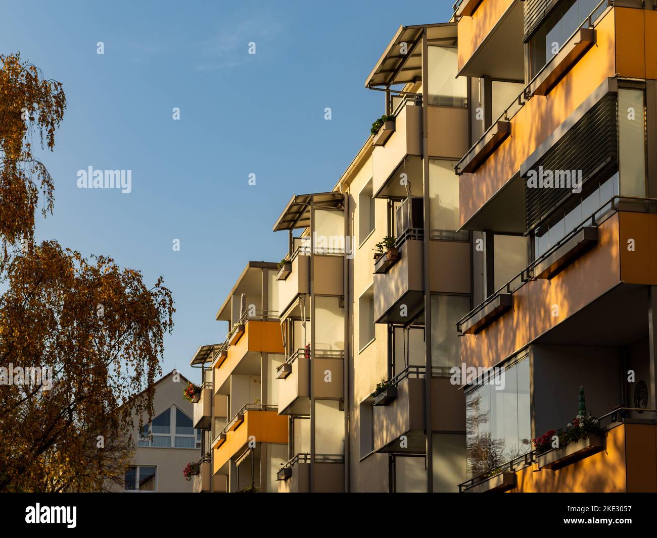 Balconies of a residential building in natural colors. Beautiful facade in the autumn season. Architecture of an apartment building. Stock Photo