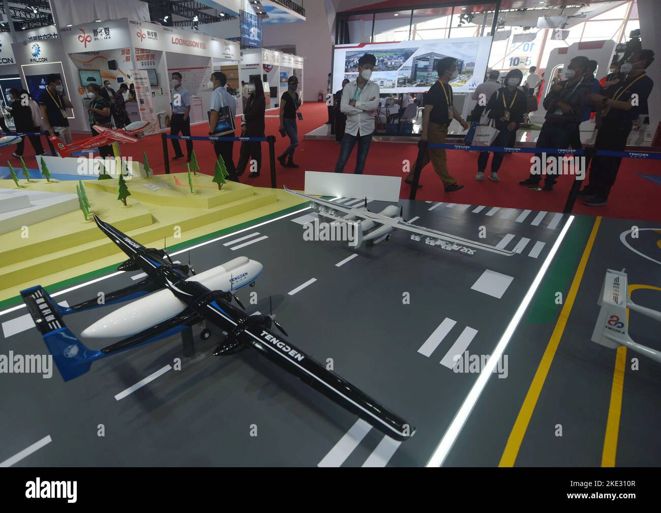 ZHUHAI, CHINA - NOVEMBER 9, 2022 - Visitors look at various advanced unmanned aerial vehicles developed by Teng Dun at Airshow China in Zhuhai, Guangd Stock Photo