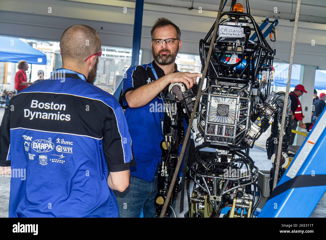 Miami Florida,Homestead,Speedway,DARPA Robotics Challenge Trials,remote controlled,robot,robots,man men male,student students engineering,adjusting,FL Stock Photo