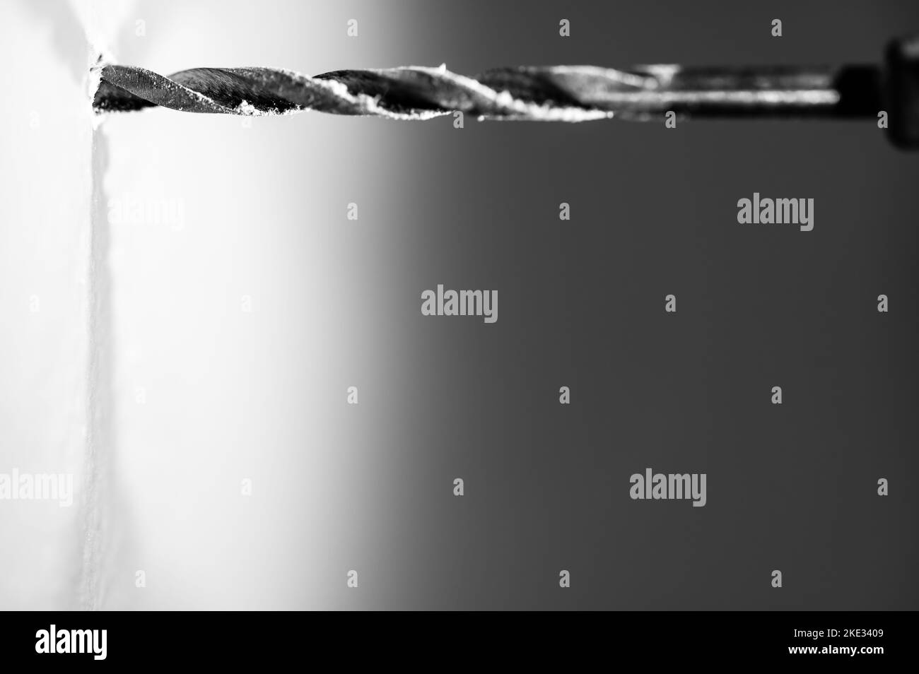 Selective focus on point of of a drill bit making a pilot